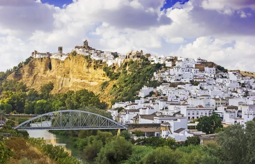 arcos de la frontera as seen from across the river, one of the best places to visit in andalucia spain