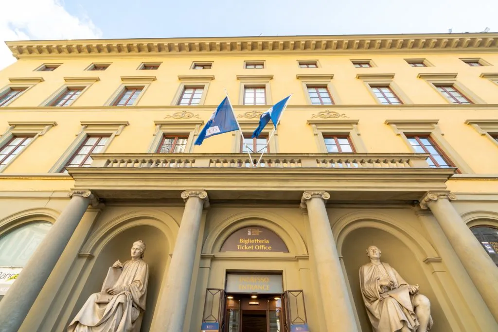 front facade of yellow building selling florence duomo tickets
