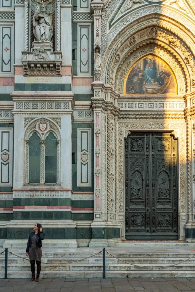 kate storm standing in front of florence duomo front doors