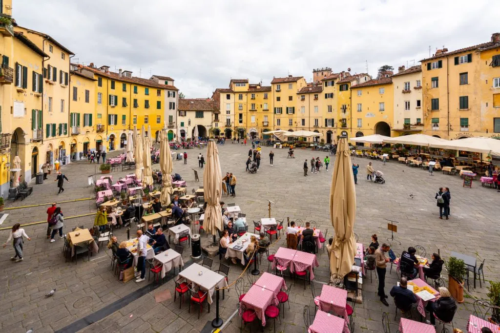 view of piazza dell'anfiteatro from above on a cloudy day, one of the best places to go in lucca italy