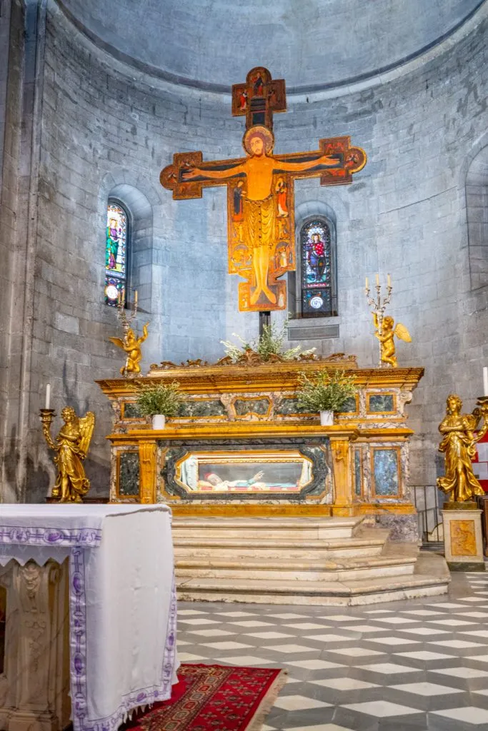 interior of basilica of san michele in foro with mummy on display
