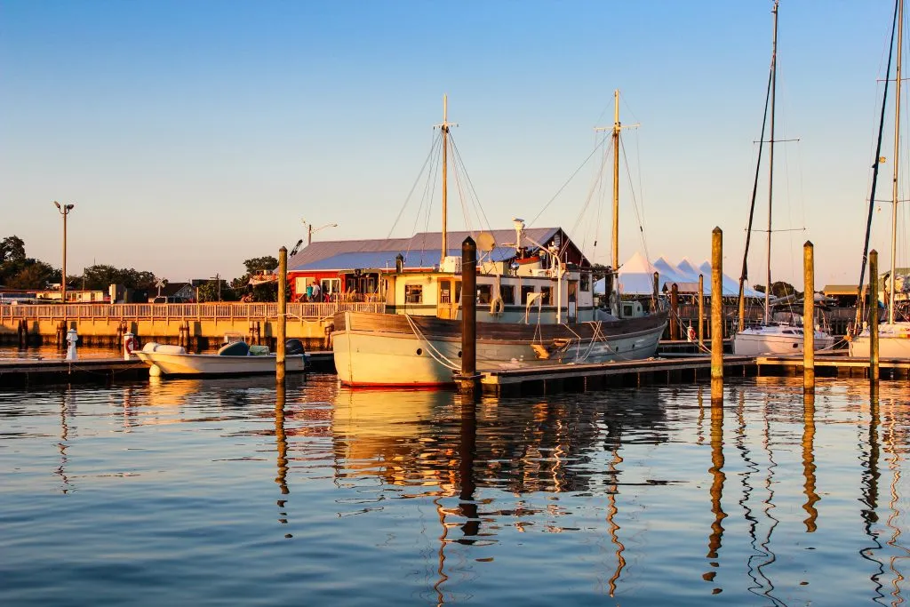 sunrise in the harbor with boats in virginia