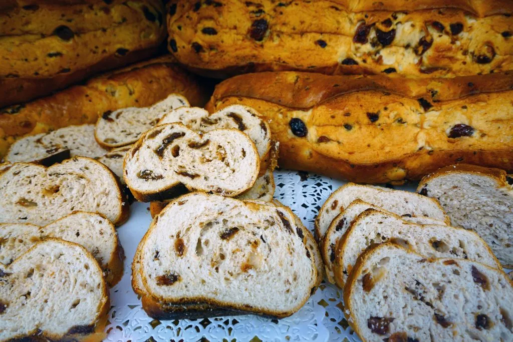 slices of buccellato di lucca cake for sale in a bakery