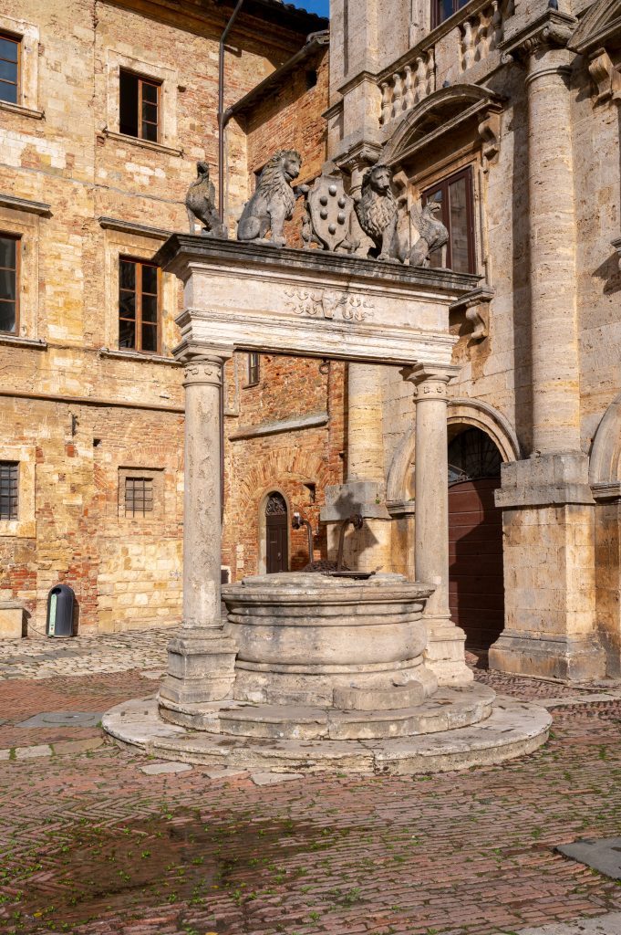historic stone fountain in piazza grande montepulciano tuscany