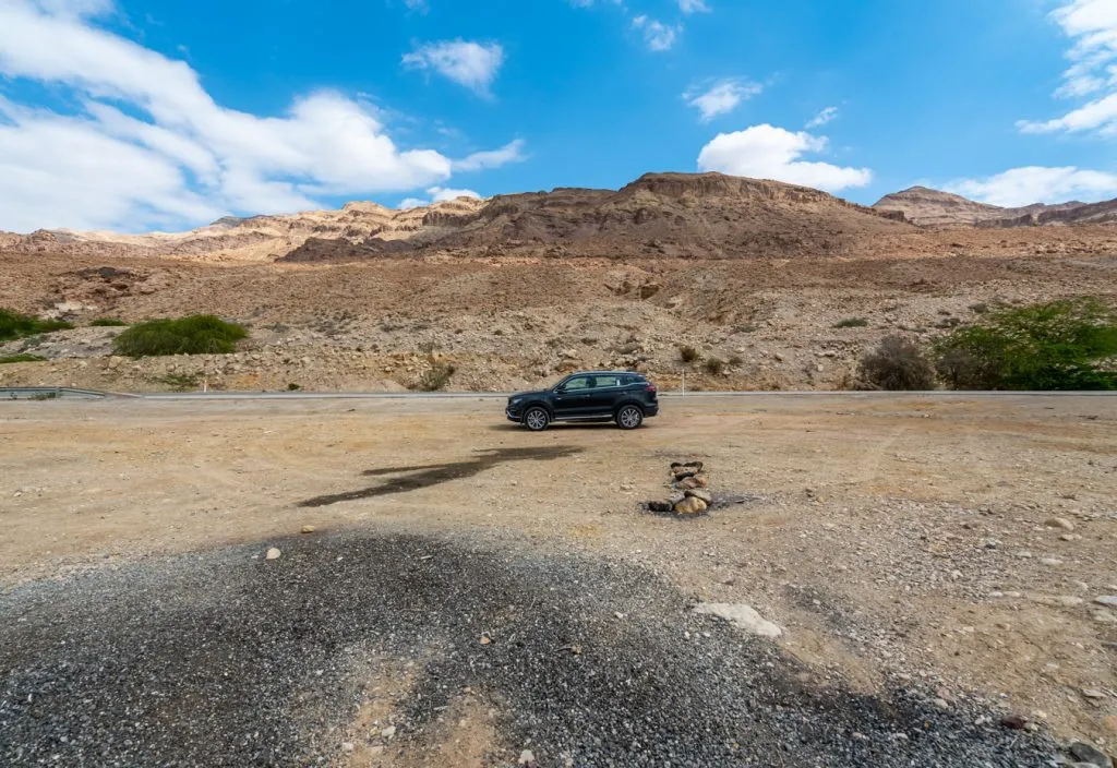 black suv parked along a rural road jordan renting a car