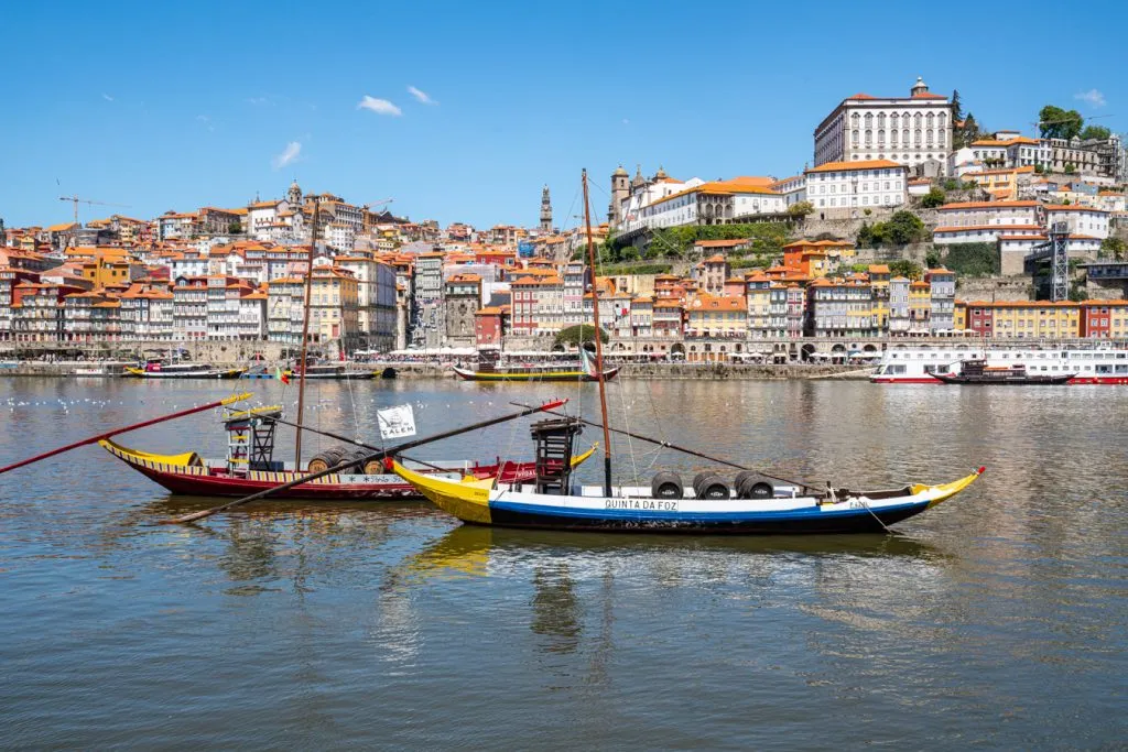 historic boats on the douro river in porto portugal, the last stop on a 14 day spain and portugal itinerary