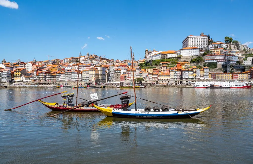 historic boats in the douro river in porto, one of the best cities in europe with beaches