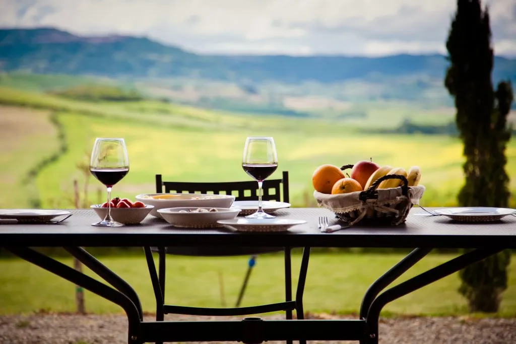 lunch with a view at a tuscan agriturismo in the countryside with 2 glasses of wine