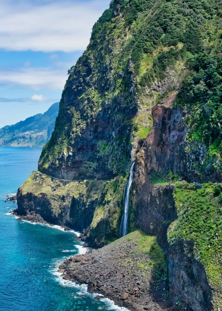 waterfall into the ocean on madeira portugal road trip view
