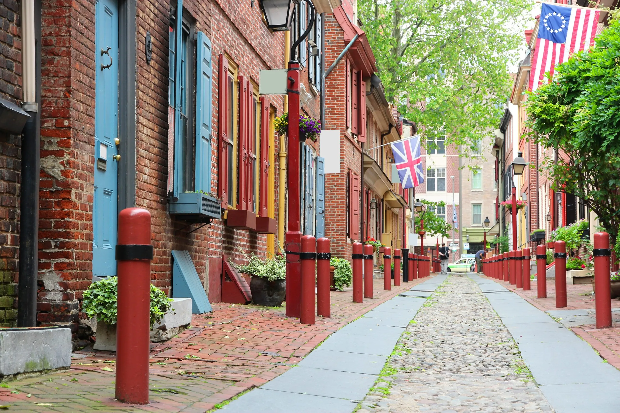 elfreths alley in philadelphia pa with cobblestones in the center, one of the best east coast cities to visit in usa