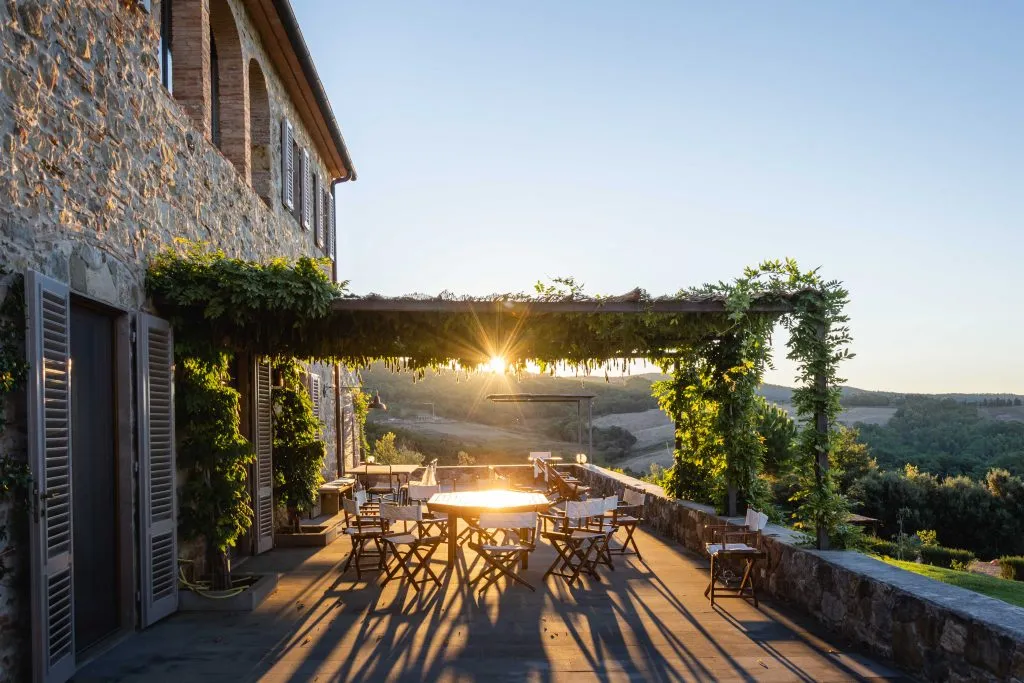 sunset over a tuscan villa balcony