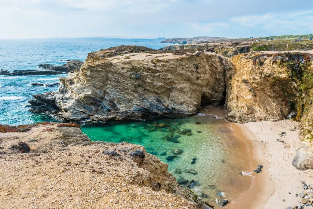 view of coastline near porto covo, as seen during a road trip portugal drive