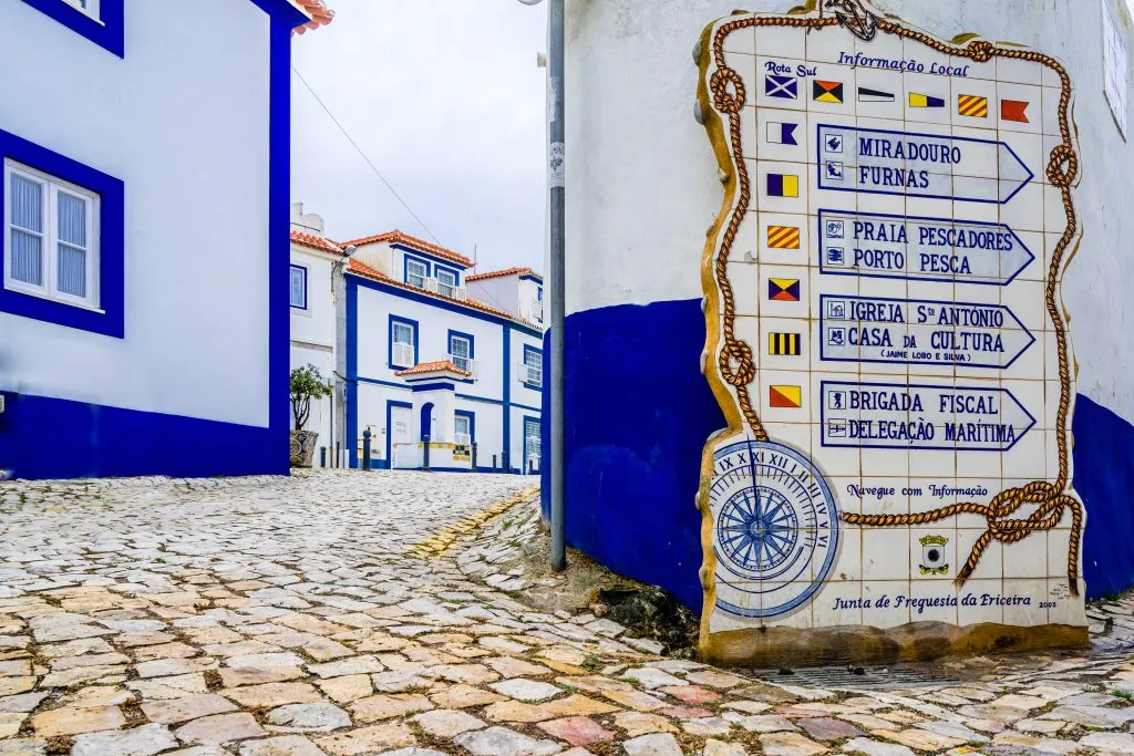 blue and white streets of ericeira, a fun stop on a road trip lisbon to porto drive