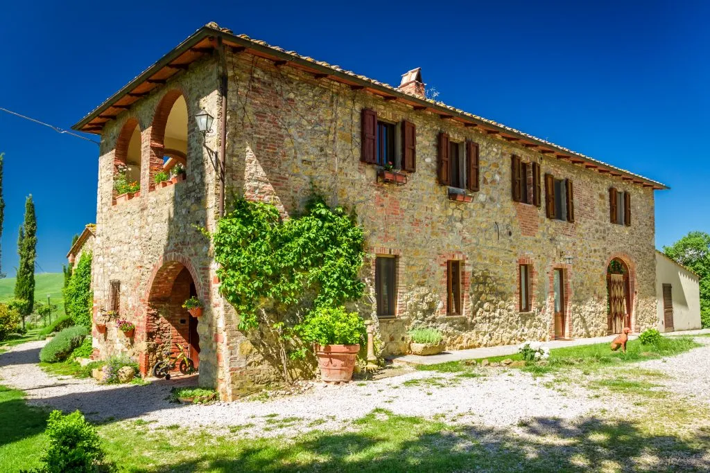 rural countryside tuscany farmhouse on a sunny day