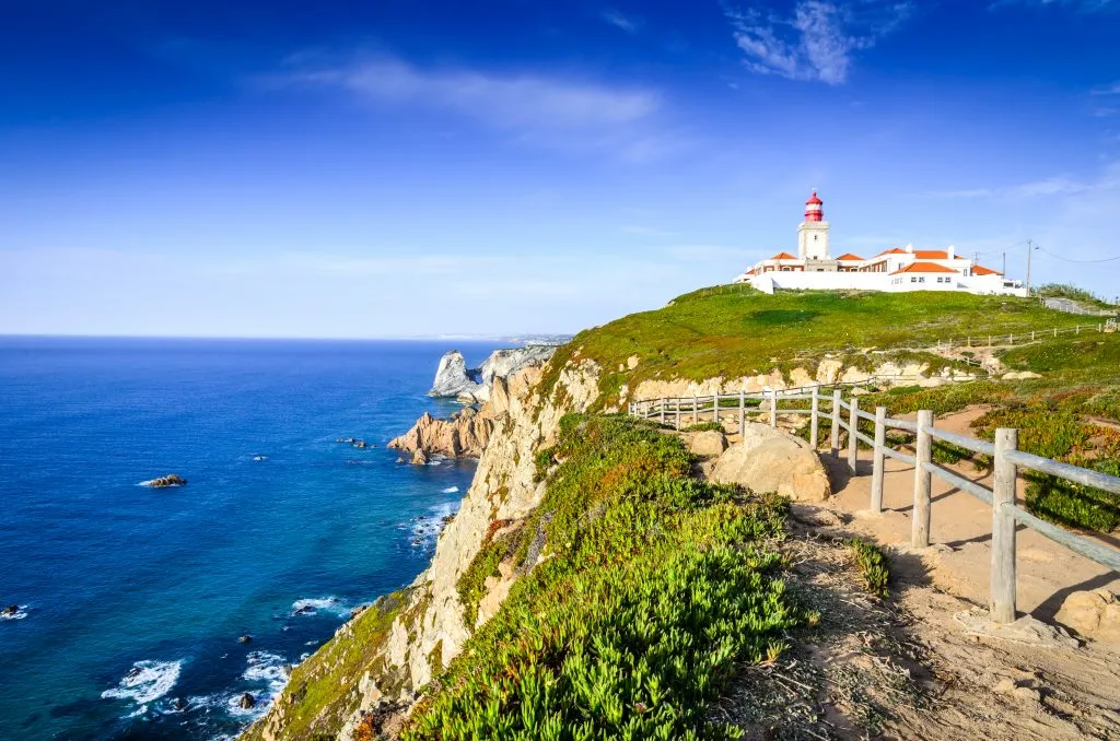 view of cabo da roca lighthouse on a sunny day, one of the best places to visit near lisbon portugal
