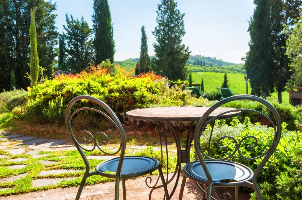 two chairs sitting on the terrace of a countryside italy villa rental