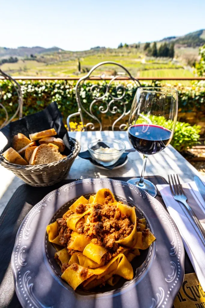 plate of pasta with bread and tuscan wine at il guerrino in montefioralle italy