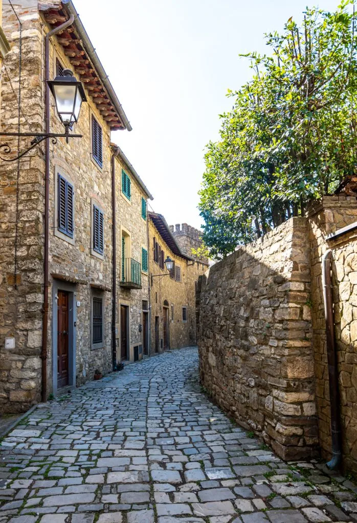 stone streets of montefioralle tuscany lined with buildings on either side