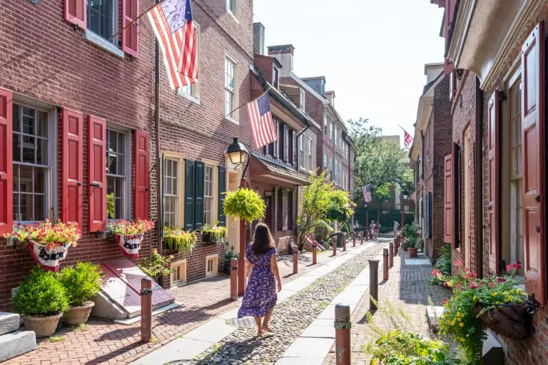 kate storm walking down elfreths alley during a long weekend in philadelphia itinerary