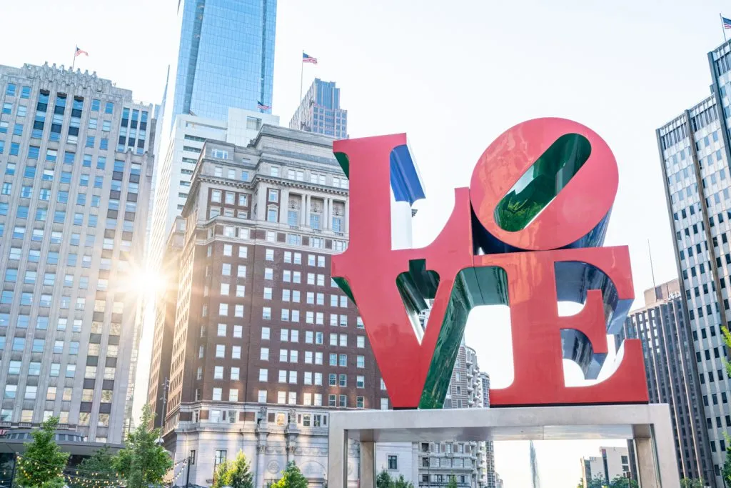 philadelphia love statue with skyscrapers in the background, one of the best things to do philadelphia weekend getaway