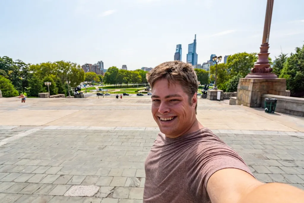 jeremy storm taking a selfie at the top of rocky steps