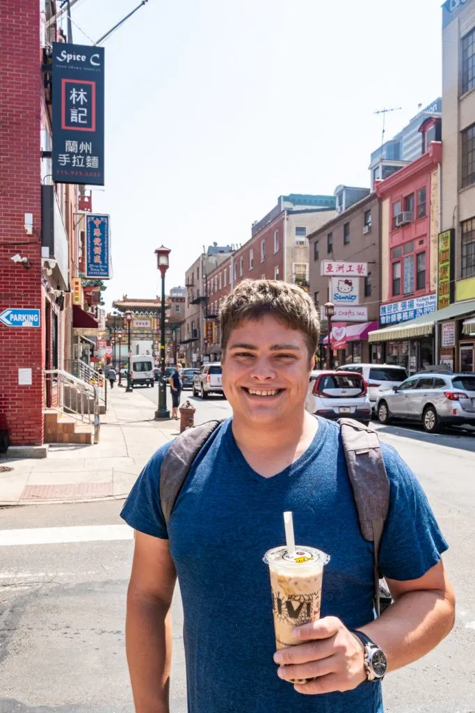 jeremy storm holding a boba tea in philadelphia chinatown