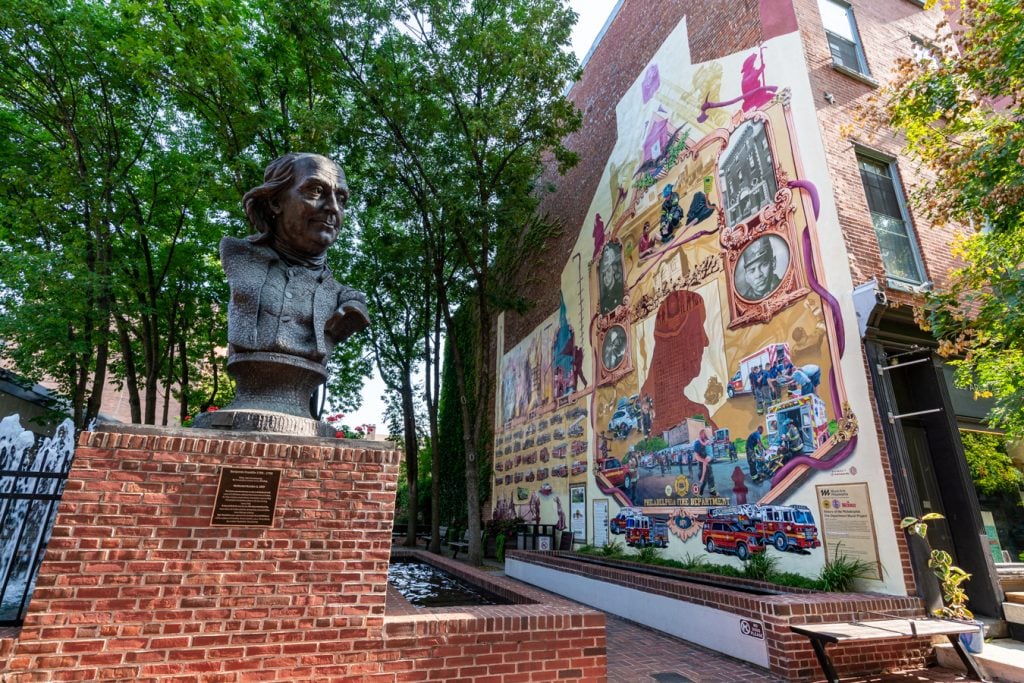mural and bust of benjamin franklin as seen during 3 days in philadelphia travel guide