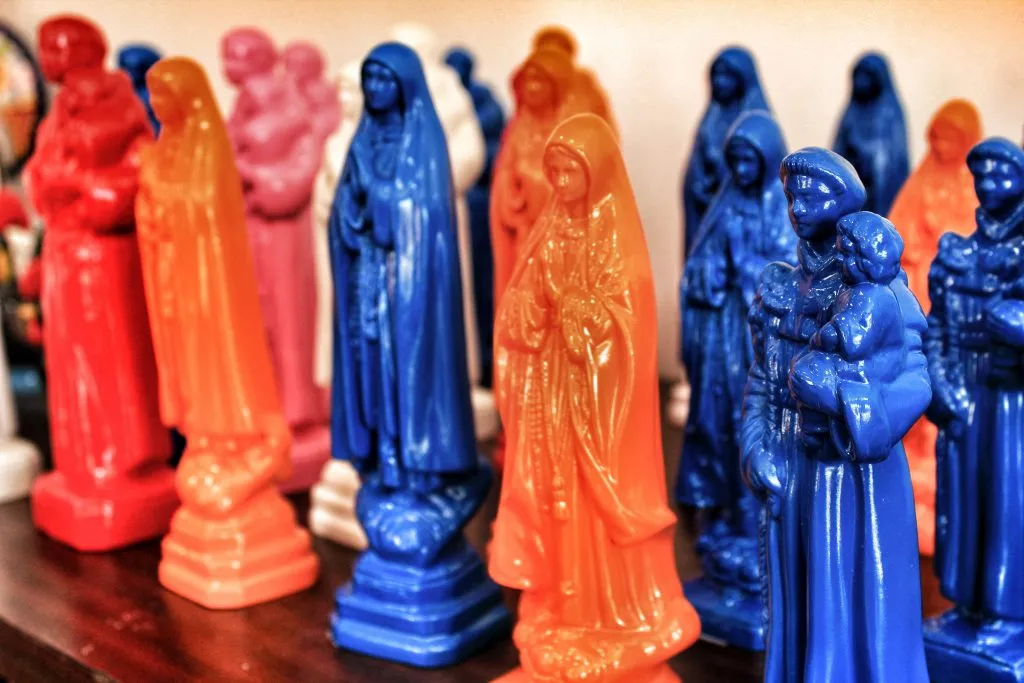 blue and orange fatima statues, some of the best souvenirs from portugal