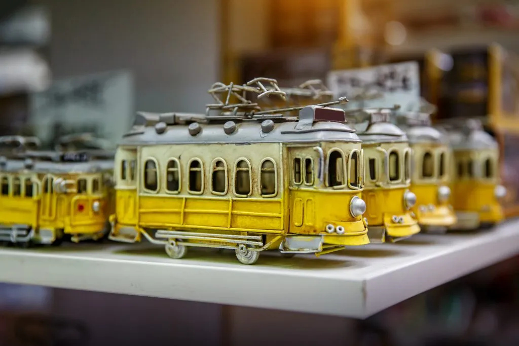 yellow tram figurines for sale, one of the fun portugal souvenirs to buy
