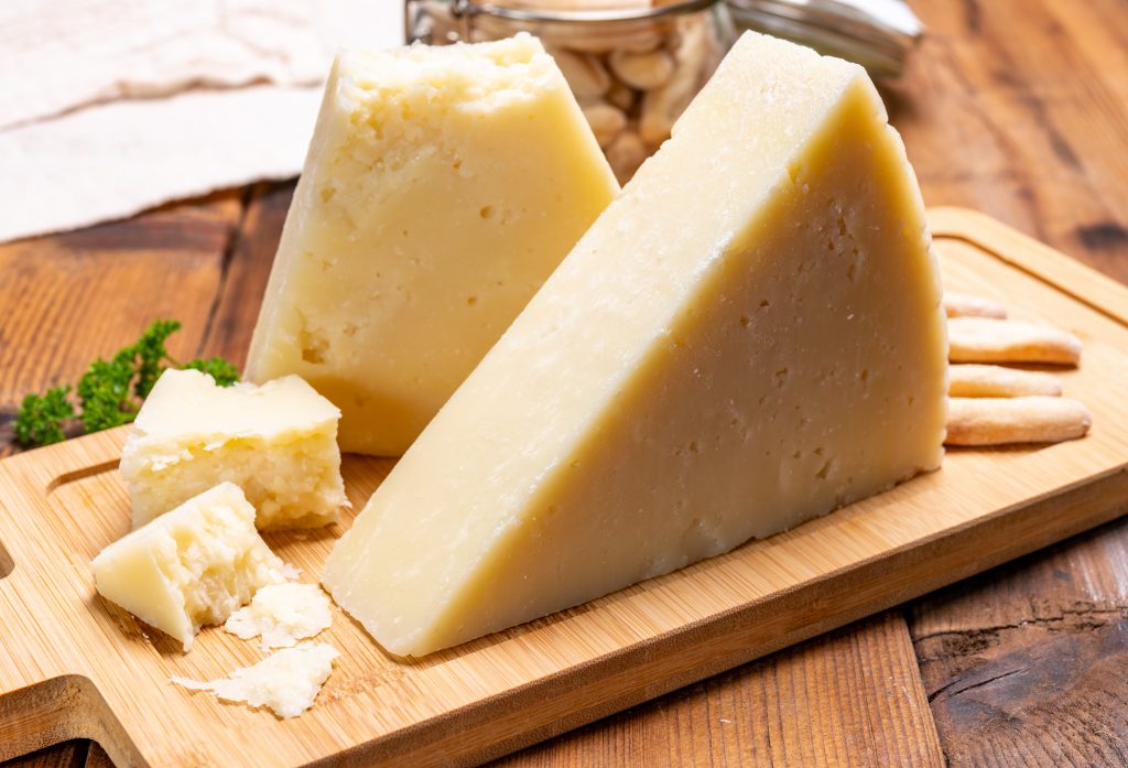 blocks of pecorino di pienza on a wooden block