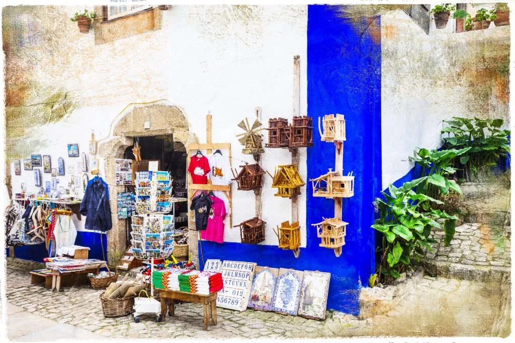 front facade of a store in obidos selling souvenirs from portugal