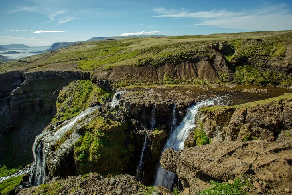 glymur waterfall as seen from hiking trail
