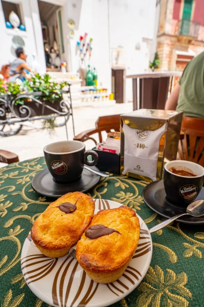 coffee and pasticiotti at an outdoor cafe in locorotondo, one of the best things to do in puglia