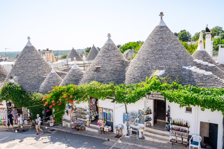 view of the trulli of alberobello puglia from a rooftop, one of the best small towns in italy to visit