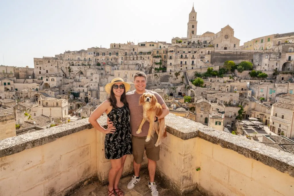 kate storm jeremy storm and ranger storm on a balcony overlooking matera on a southern italy itinerary