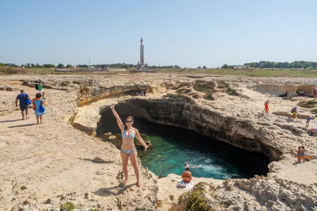 kate storm standing on the edge of the cave of poetry puglia italy