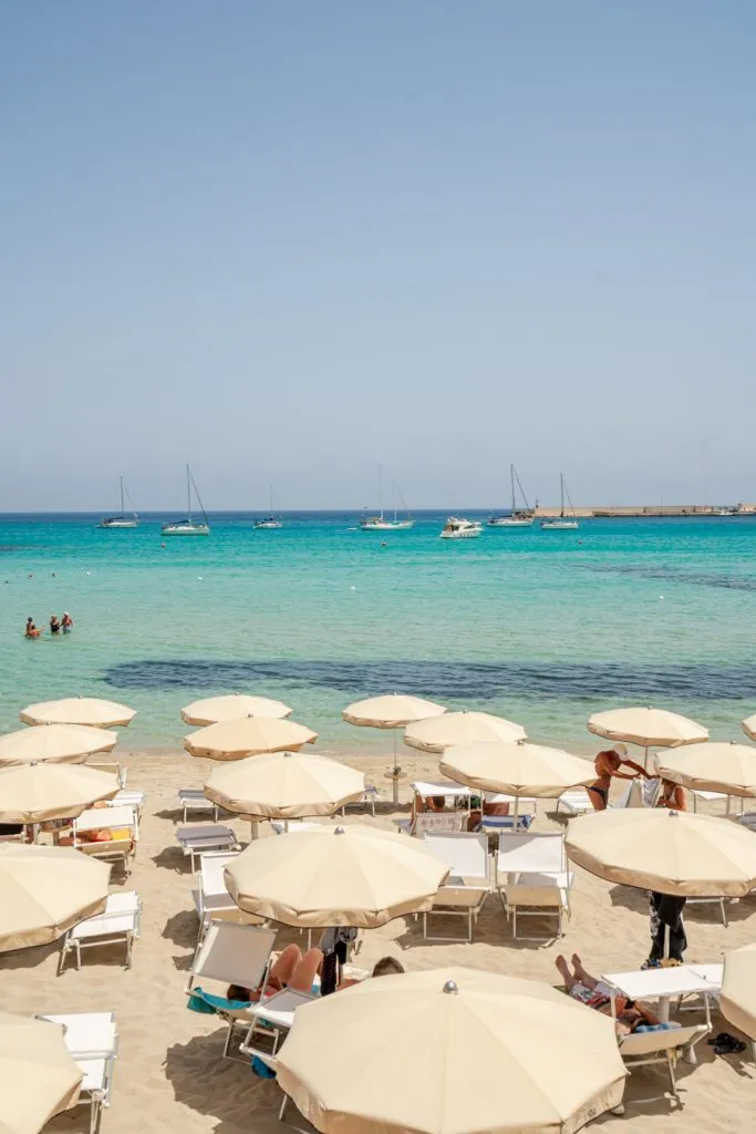 umbrellas of a lido overlooking the sea as seen when visiting otranto italy