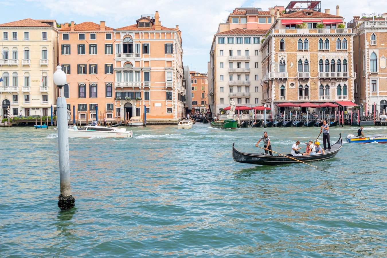 gondola traghetto in venice with passengers approaching from grand canal