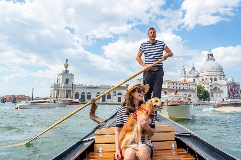 kate storm and ranger storm in a traghetto gondola during summer in venice italy