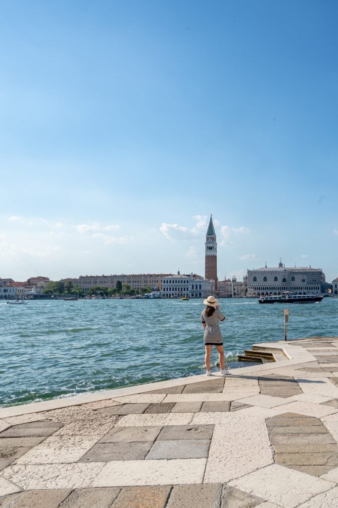 kate storm standing on the edge of the island san giorgio maggiore