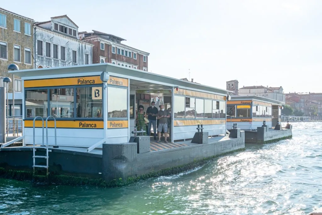 view of a venice vaporetto station from the water