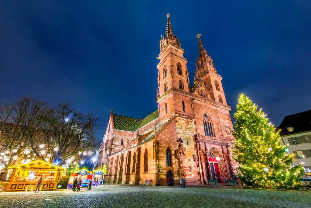 basel switzerland christmas market next to the munster cathedral, one of the best winter destinations in europe winter getaways