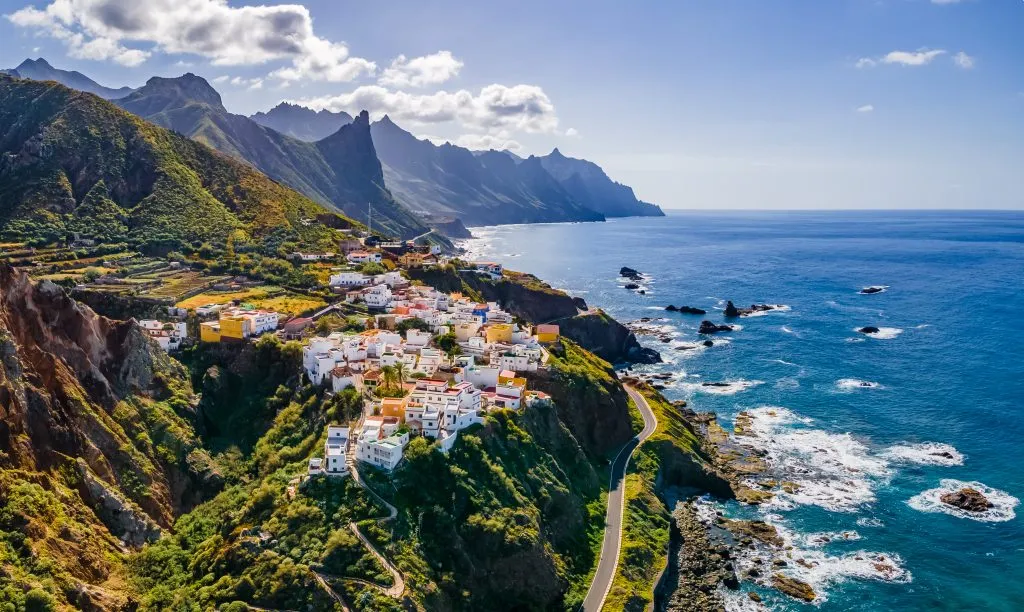 white village perched on a dramatic cliff in tenerife, one of the best winter sun destinations in europe
