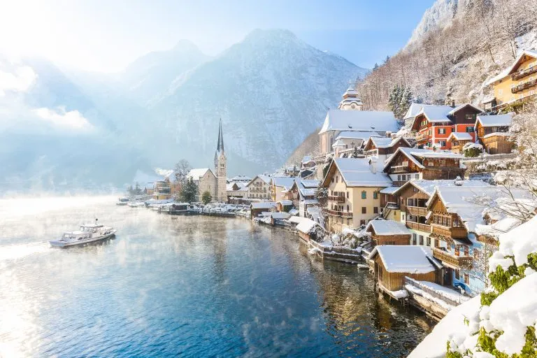snowy hallstatt austria, one of the best places to visit in europe in winter