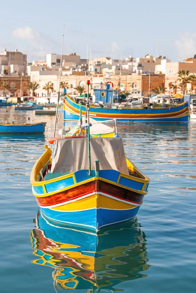 colorful fishing boat in harbor of Marsaxlokk malta, one of the best places to visit in europe winter sun