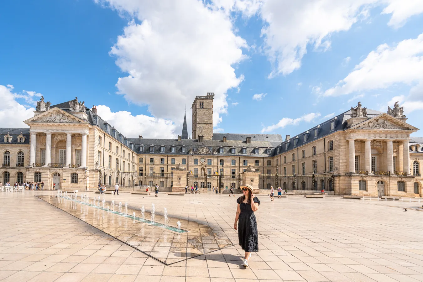 kate storm with the ducal palace in liberation square, one of the best things to do in dijon france