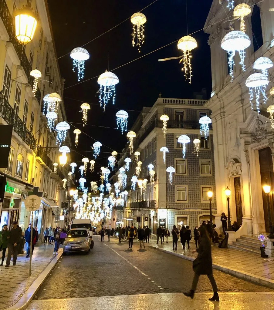 jellyfish christmas lights hanging in chiado lisbon at night