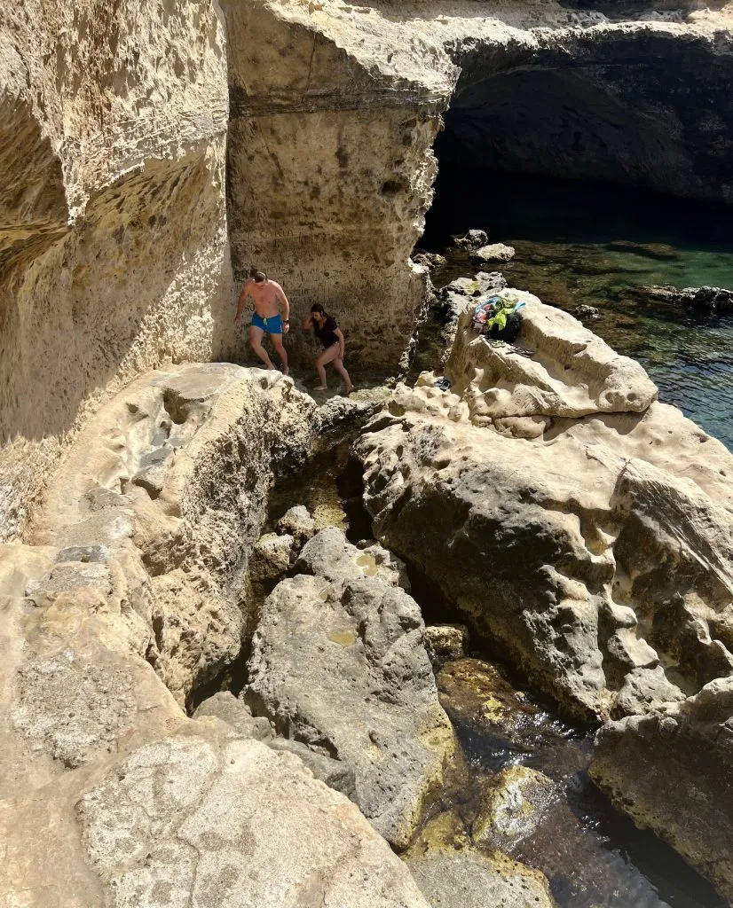 rocky staircase leading into grotta della poesia puglia