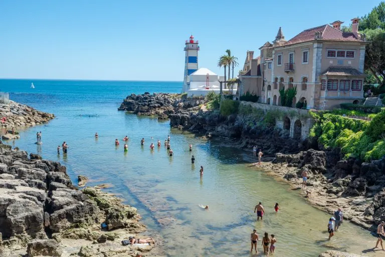 santa marta lighthouse as seen beyond the water, one of the best places to visit in cascais day trip from lisbon