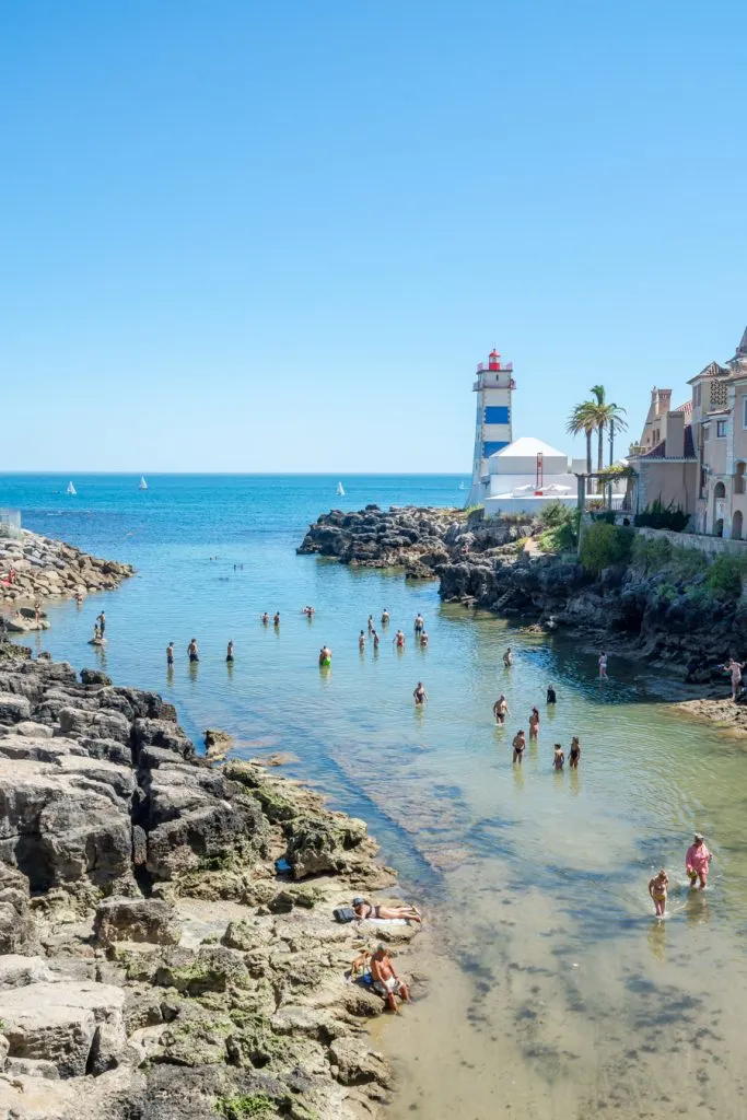 lighthouse and swimming hole on the sea in cascais portugal
